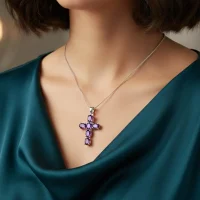 model wearing silver pendant cross design with 4x6mm oval amethyst