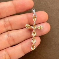 silver pendant cross design with 4x6mm pear citrine displayed on hand