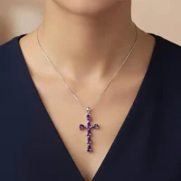 model wearing silver pendant cross design with 4x6mm pear amethyst