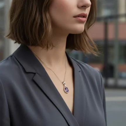 model wearing silver pendant with 5x7 mm oval shaped amethyst