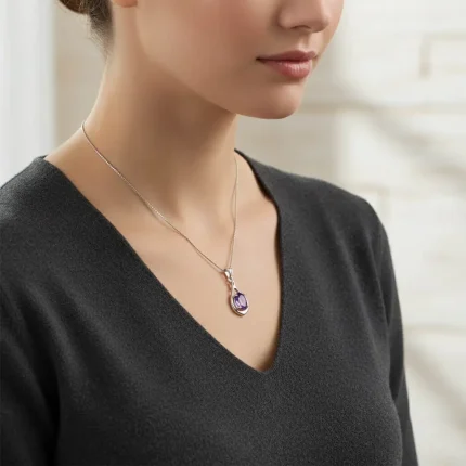 model wearing silver pendant with 5x7 mm oval shaped brazilian amethyst