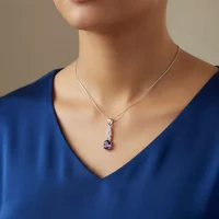 model wearing silver pendant with 5x7 mm oval amethyst