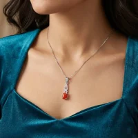 model wearing silver pendant with 5x7 mm oval red onyx cabochon