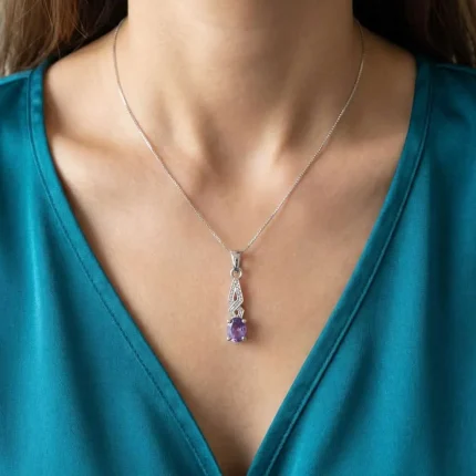 model wearing silver pendant with 5x7 mm oval brazilian amethyst