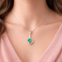 model wearing silver pendant with 5x7 mm oval green onyx