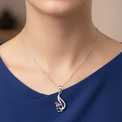 model wearing silver pendant with 5x7 mm oval amethyst