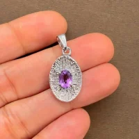 silver pendant with 5x7 mm oval brazilian amethyst displayed on hand