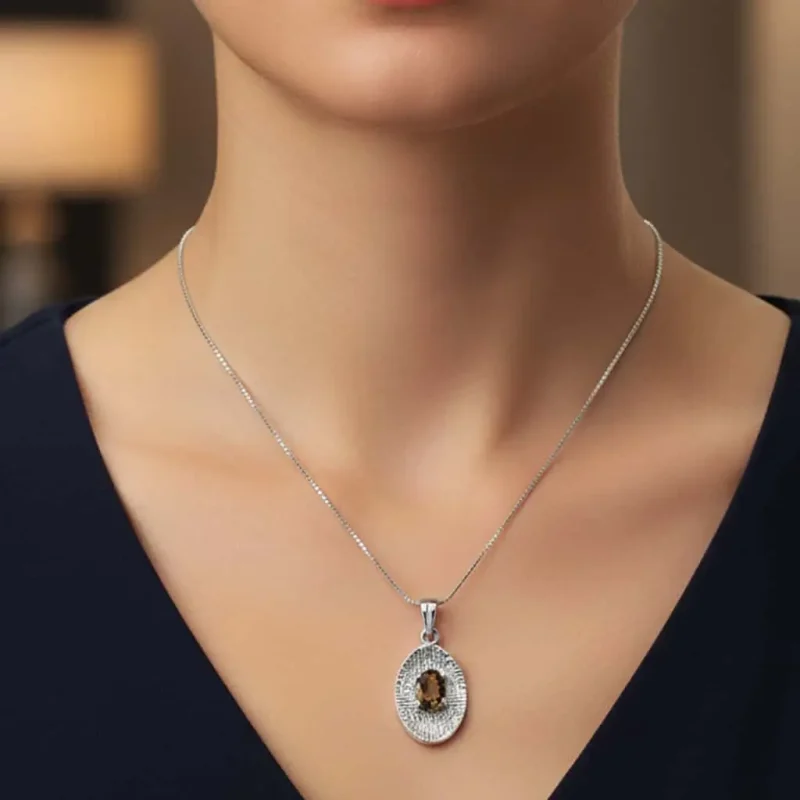 model wearing silver pendant with 5x7 mm oval smoky quartz