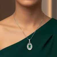 model wearing silver pendant with 5x7 mm oval green onyx