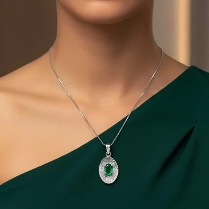 model wearing silver pendant with 5x7 mm oval green onyx
