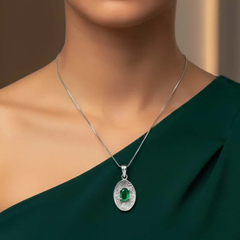 model wearing silver pendant with 5x7 mm oval green onyx