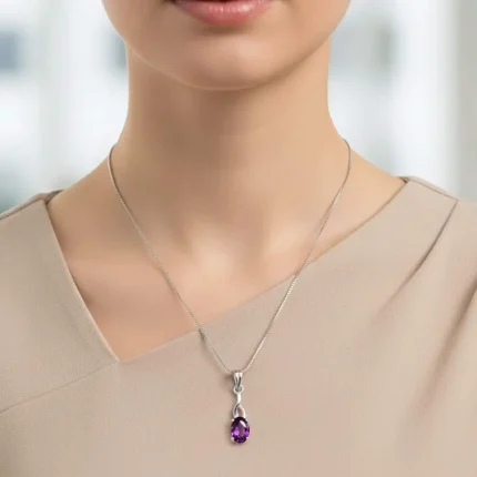 model wearing silver pendant with 5x7 mm oval amethyst