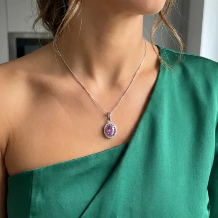 model wearing silver pendant with 5x7 mm oval brazilian amethyst