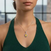 model wearing silver pendant with 5x7 mm oval citrine