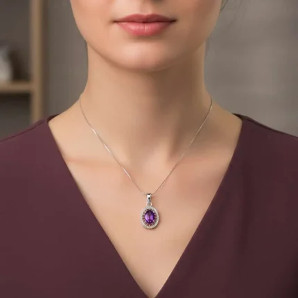 model wearing silver pendant with 5x7 mm oval amethyst