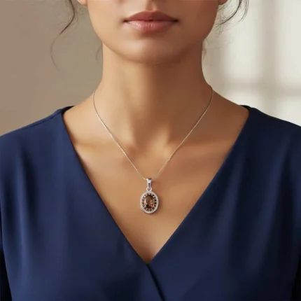 model wearing silver pendant with 5x7 mm oval smoky quartz