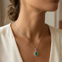 model wearing silver pendant with 5x7 mm oval green onyx