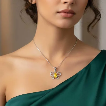 model wearing silver pendant butterfly shaped with 5x7 mm oval citrine