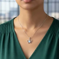 model wearing silver pendant butterfly shaped with 5x7 mm oval rainbow moonstone