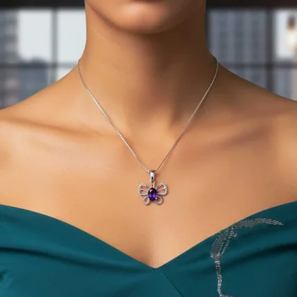 model wearing silver pendant butterfly shaped with 5x7 mm oval amethyst