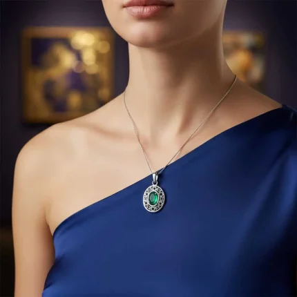 model wearing silver pendant with 5x7 mm oval green onyx