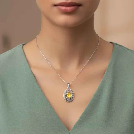 model wearing silver pendant with 5x7 mm oval citrine