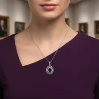 model wearing silver pendant with 5x7 mm oval black onyx