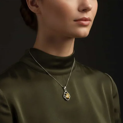 model wearing silver pendant with 5x7 mm oval citrine