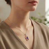 model wearing silver pendant with 5x7 mm oval amethyst