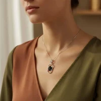 model wearing silver pendant with 5x7 mm oval black onyx