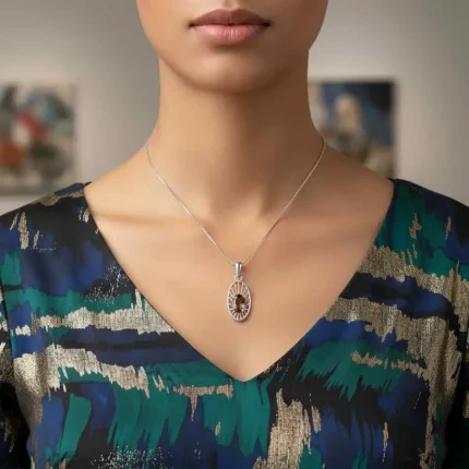 model wearing silver pendant with 5x7 mm oval smoky quartz