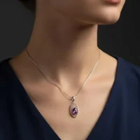 model wearing silver pendant with 5x7 mm oval amethyst