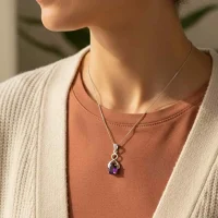 model wearing silver pendant with 5x7 mm oval amethyst