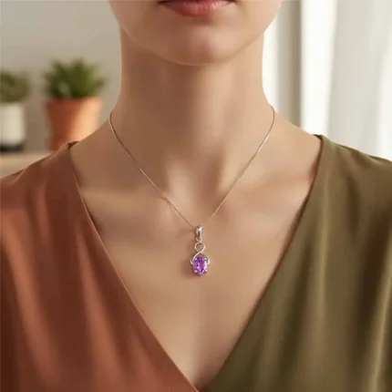 model wearing silver pendant with 5x7 mm oval brazilian amethyst