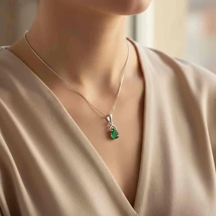 model wearing silver pendant with 6x4 mm pear green onyx