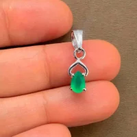 silver pendant with 6x4 mm pear green onyx displayed on hand