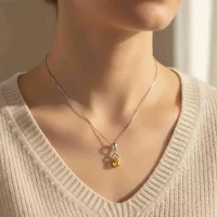 model wearing silver pendant with 6x4 mm pear citrine