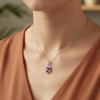 model wearing silver pendant with 6x4 mm oval amethyst