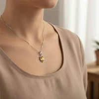 model wearing silver pendant with 6x4 mm oval citrine