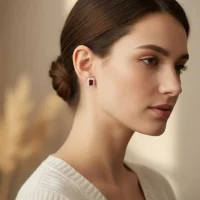 model wearing silver studs cluster with 5x7 mm octagon Garnet and cubic zirconia