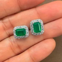 silver studs cluster with 5x7 mm octagon Green Onyx and cubic zirconia displayed on hand