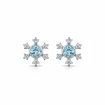 silver studs snowflake design with 5 mm round blue topaz in band setting and cubic zirconia in prong setting