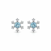 silver studs snowflake design with 5 mm round blue topaz in band setting and cubic zirconia in prong setting