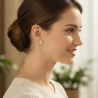 model wearing silver studs cluster with 7x5 mm pear Citrine and cubic zirconia