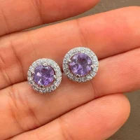 silver studs cluster with 6mm round Brazilian Amethyst and cubic zirconia displayed on hand