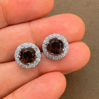 silver studs cluster with 6mm round Smoky Quartz and cubic zirconia displayed on hand