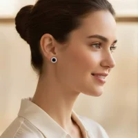 model wearing silver studs cluster with 6mm round Black Onyx and cubic zirconia