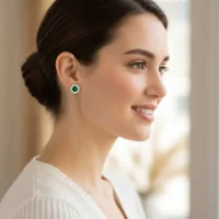 model wearing silver studs cluster with 6mm round Green Onyx and cubic zirconia