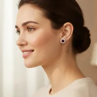 model wearing silver studs cluster with 6mm round Garnet and cubic zirconia