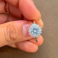 silver ring cluster (gidhe) with 6mm round cubic zirconia displayed on hand